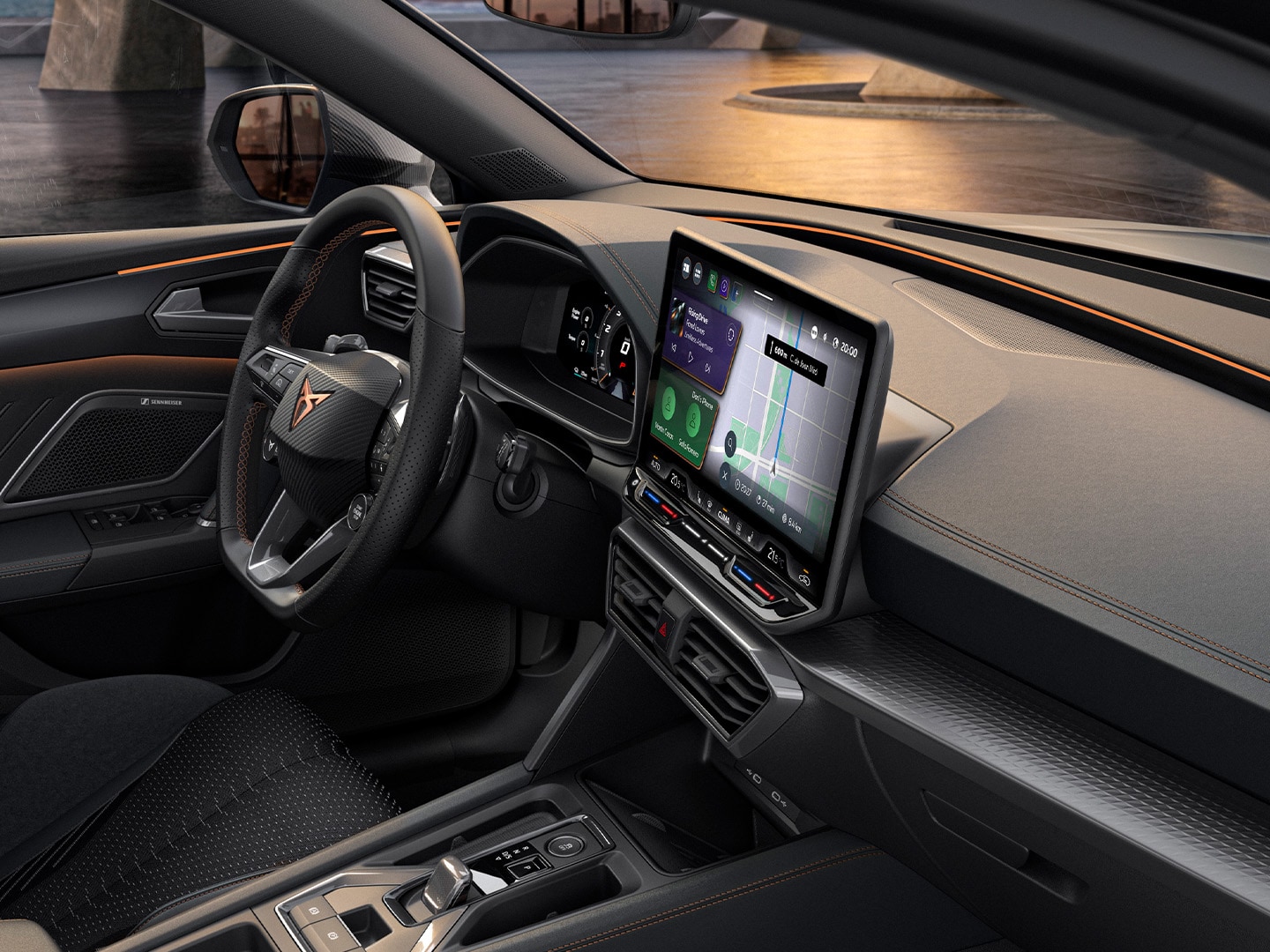 Interior view of the CUPRA Leon highlighting the driver-centric interface that includes a 12.9 touchscreen and a steering wheel with buttons and satellites.