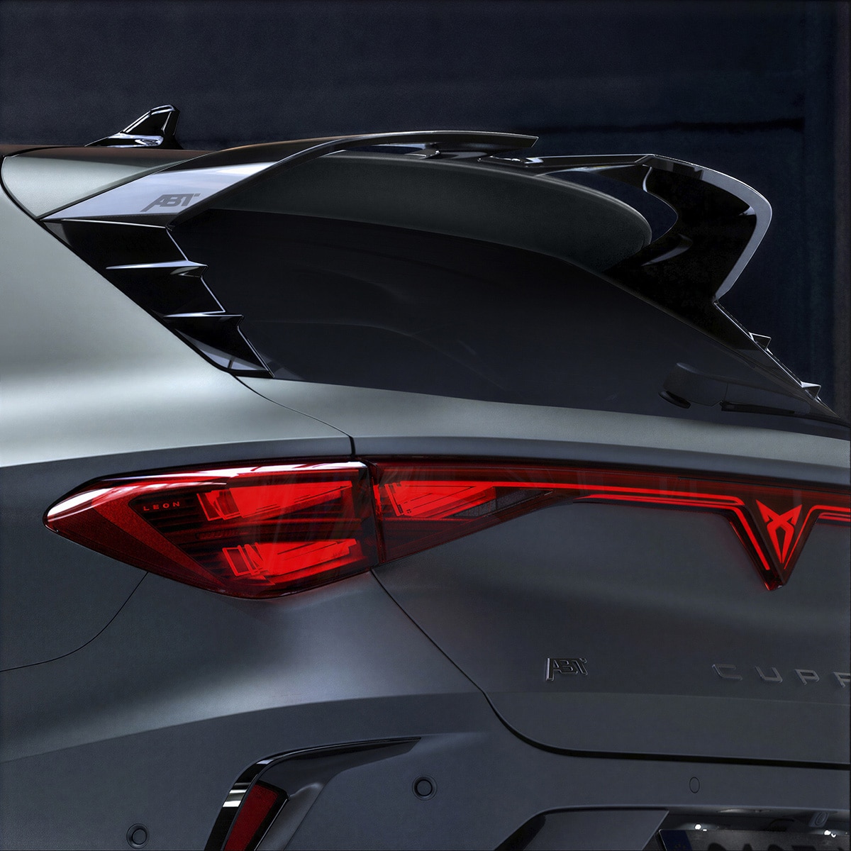 Rear view of the CUPRA Leon, highlighting the Custom Pack aggressive rear wing spoiler.