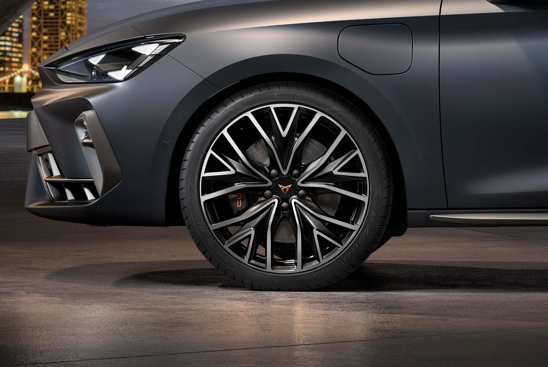 front side view of left mistral machined alloy wheels in silver and black for the new cupra leon sportstourer 2025, tyres, signature headlights and grey body