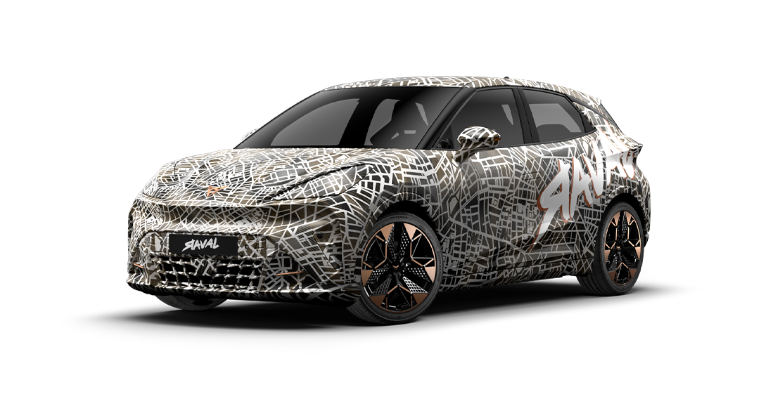The CUPRA Raval VZ Extreme is shown from the front three-quarter view, covered in a black and white street map camouflage wrap. The car features black and copper-accented wheels and has the word "RAVAL" on the front grille.