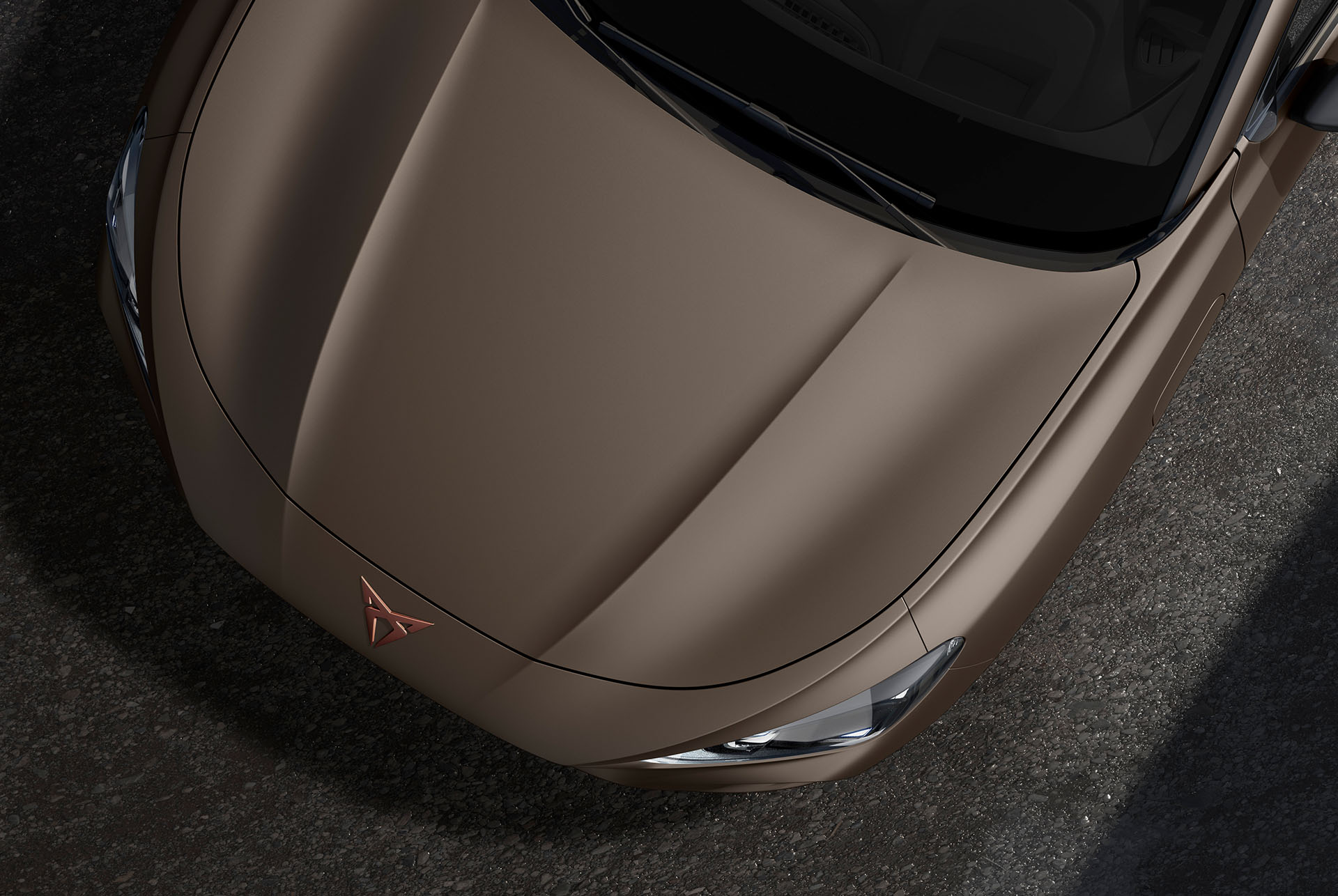 Upper shot of the CUPRA Terramar’s front in the century bronze matt finish.