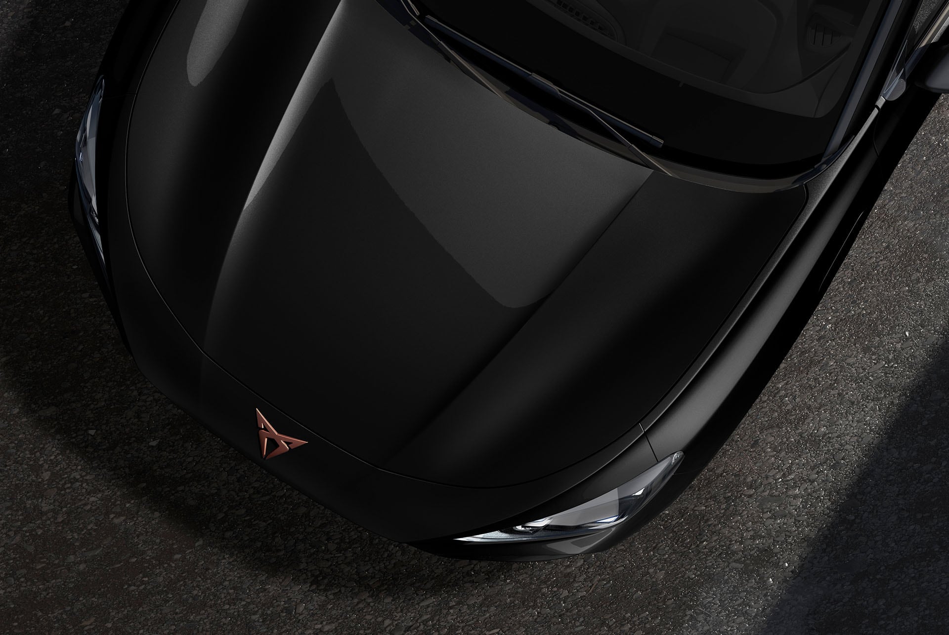 Upper shot of the CUPRA Terramar’s front in midnight black metallic.