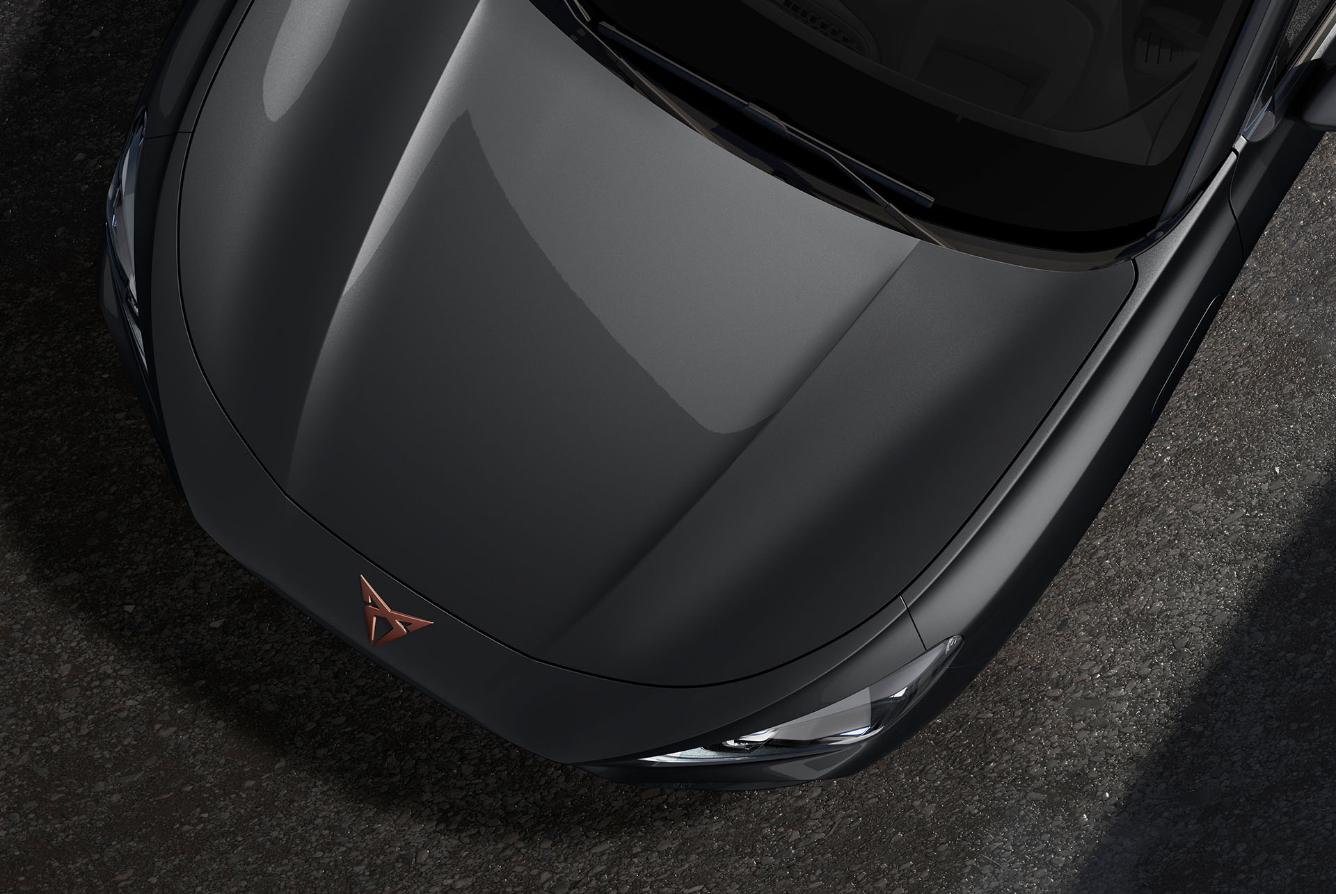 Upper shot of the CUPRA Terramar’s front to showcase the timanfaya grey metallic finish.