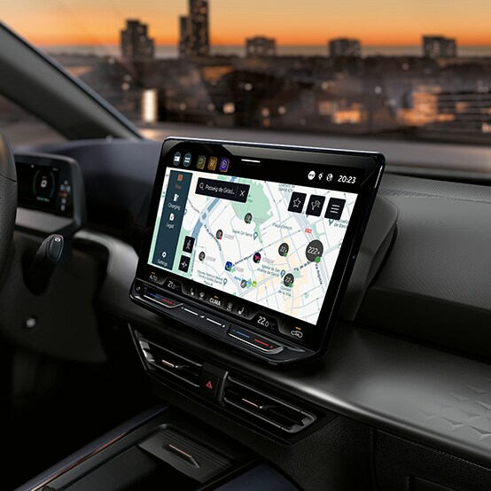 Cupra born car interior in aurora blue with infotainment system and charging points on infotainment system thanks to cupra connect.