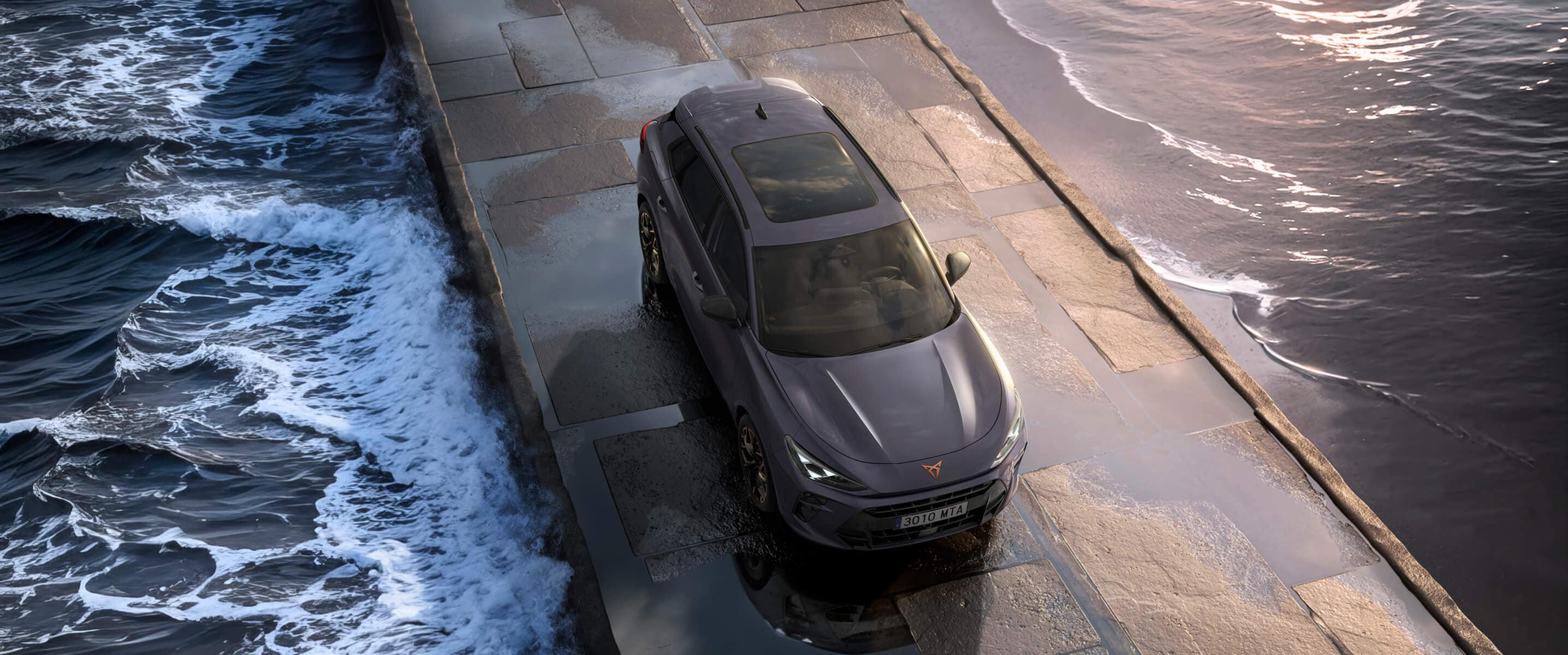 The cupra terramar 2024 hybrid suv on a wet pavement by the sea, featuring sleek headlights, modern alloy wheels, and a shark-inspired front design.