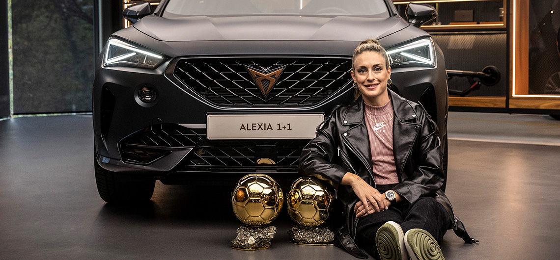 alexia putellas sitting in front of black cupra formentor vehicle